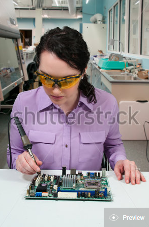 scientist holding the hot end of a soldering iron